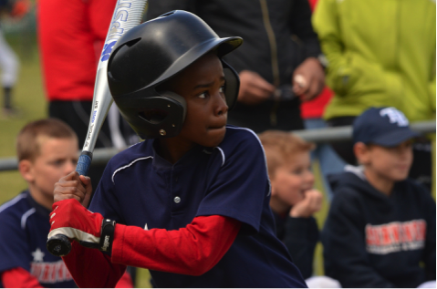 child playing baseball