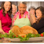 family staring at cooked turkey