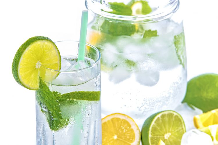 water pitcher and water glass with mint and citrus