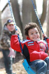 kid on swing