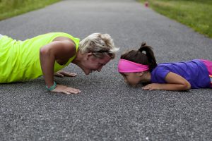 adult and child doing push ups