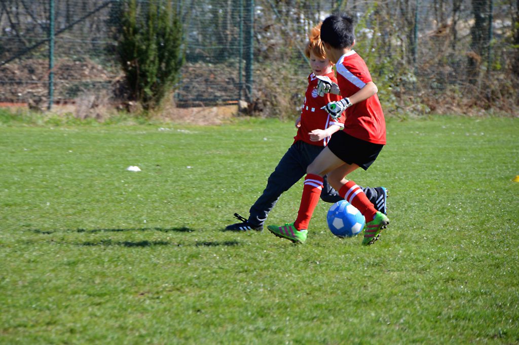 kids playing soccer outside