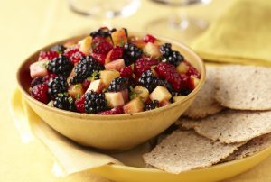 bowl of fruit with cinnamon crisps