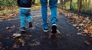 parent and child walking outside