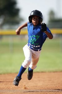 child playing baseball
